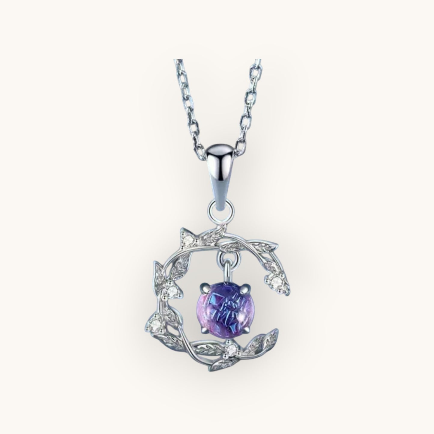 TITLIYA silver pendant necklace featuring a round purple stone set in a delicate leaf-inspired frame with crystals.