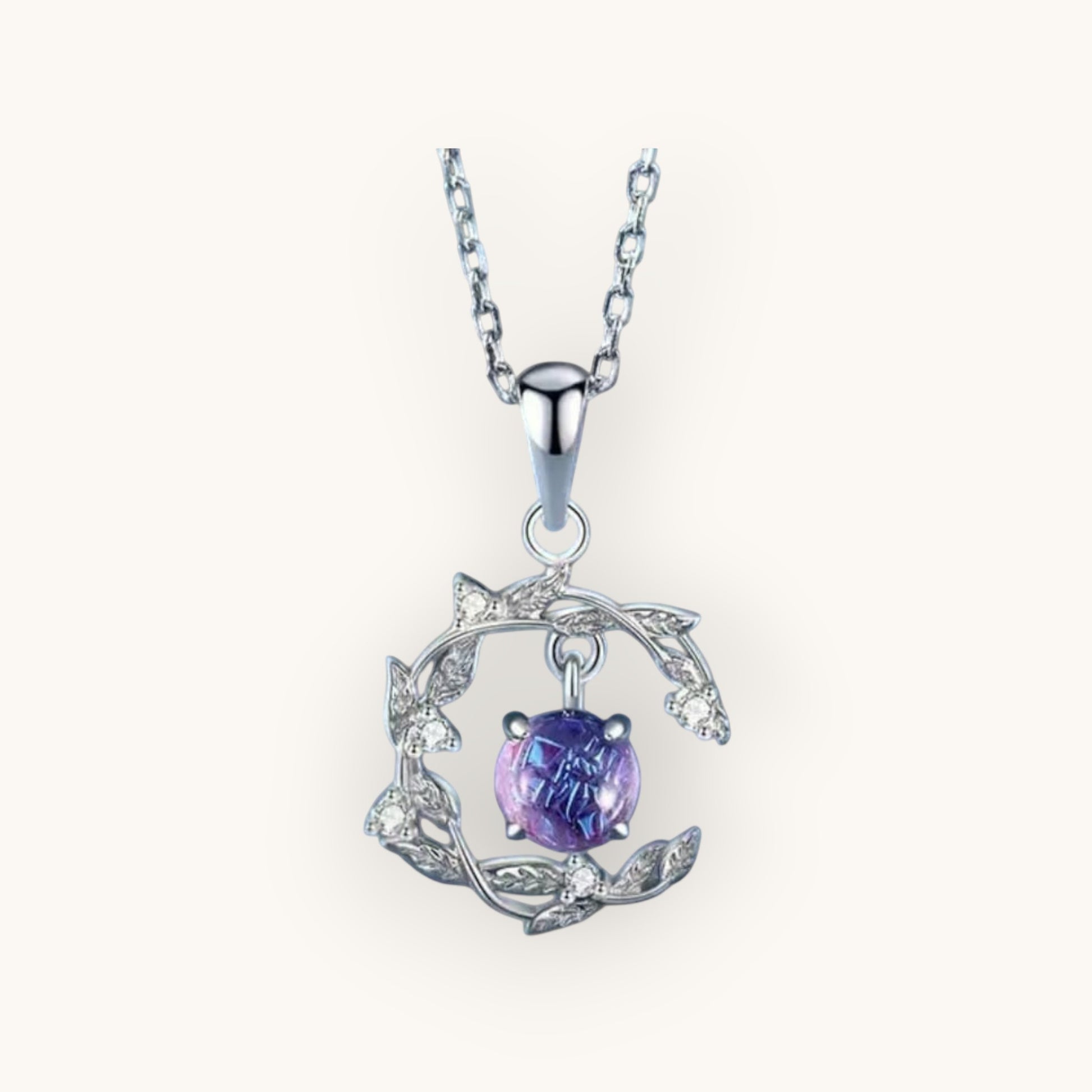 TITLIYA silver pendant necklace featuring a round purple stone set in a delicate leaf-inspired frame with crystals.