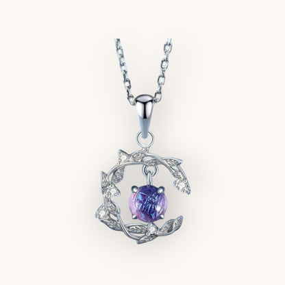 TITLIYA silver pendant necklace featuring a round purple stone set in a delicate leaf-inspired frame with crystals.
