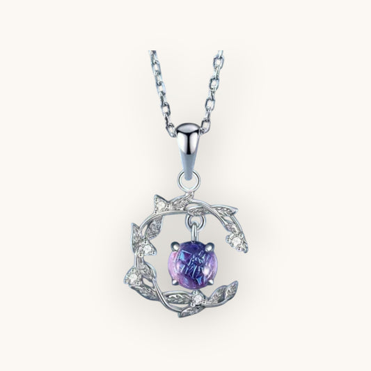 TITLIYA silver pendant necklace featuring a round purple stone set in a delicate leaf-inspired frame with crystals.