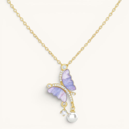 TITLIYA gold-tone butterfly pendant with purple zircon wings, sparkling crystals, and a delicate pearl drop necklace.