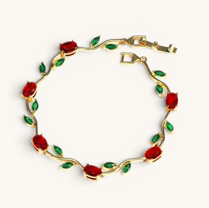 TITLIYA gold-tone vine bracelet featuring red tulip stones and green leaf accents in a floral botanical design.