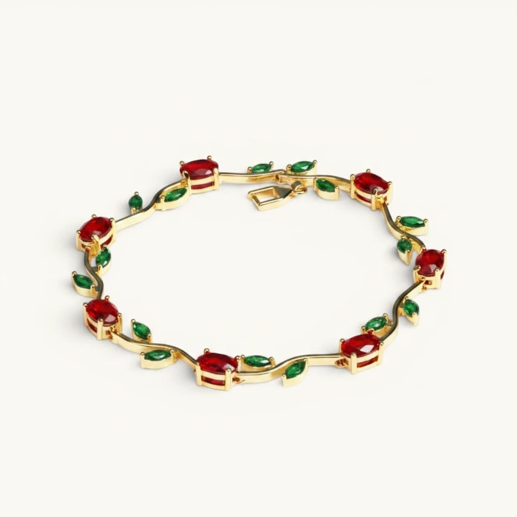 TITLIYA gold-tone vine bracelet featuring red tulip-inspired stones and green leaf accents in a floral design.