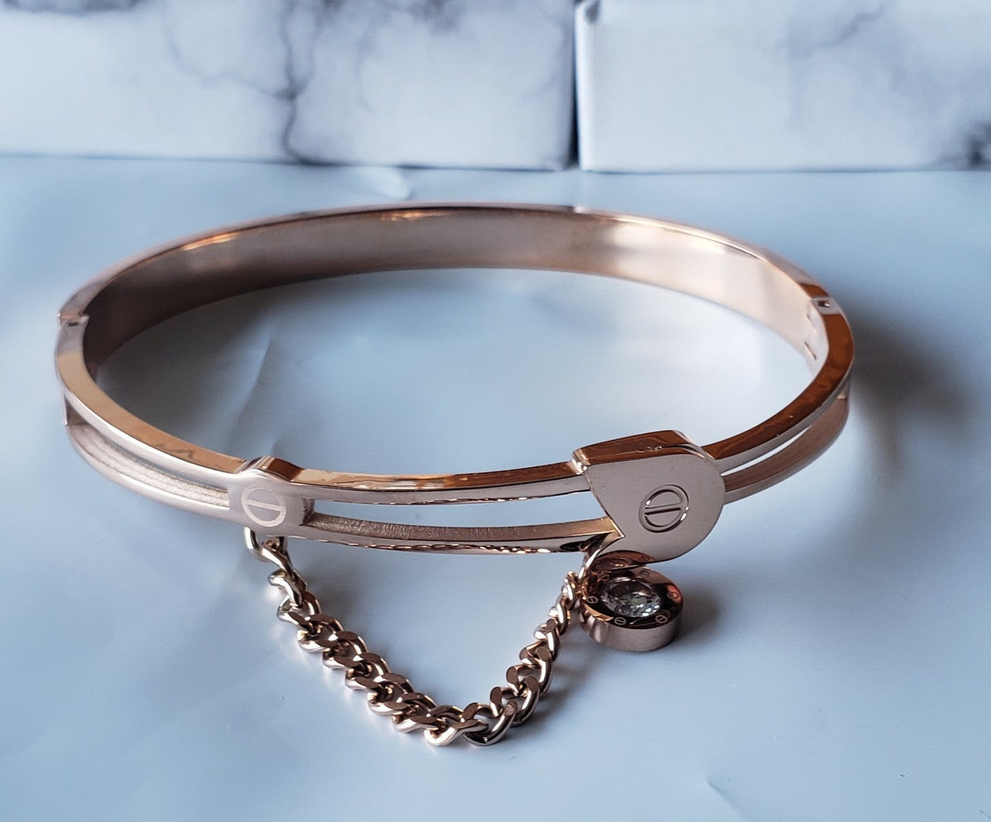 TITLIYA rose gold bangle bracelet with a delicate chain and crystal charm, perfect for elegant daily wear.