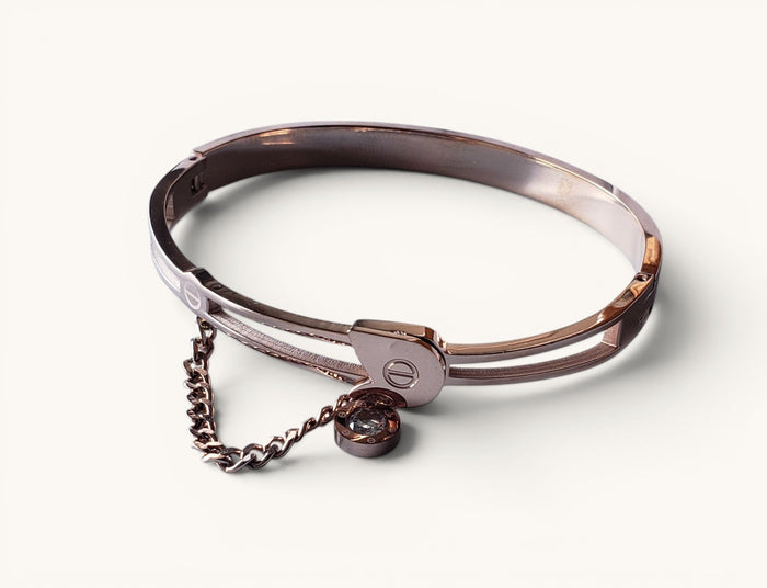 TITLIYA rose gold tone metal bangle bracelet with a delicate chain charm and crystal accent for elegant daily wear.