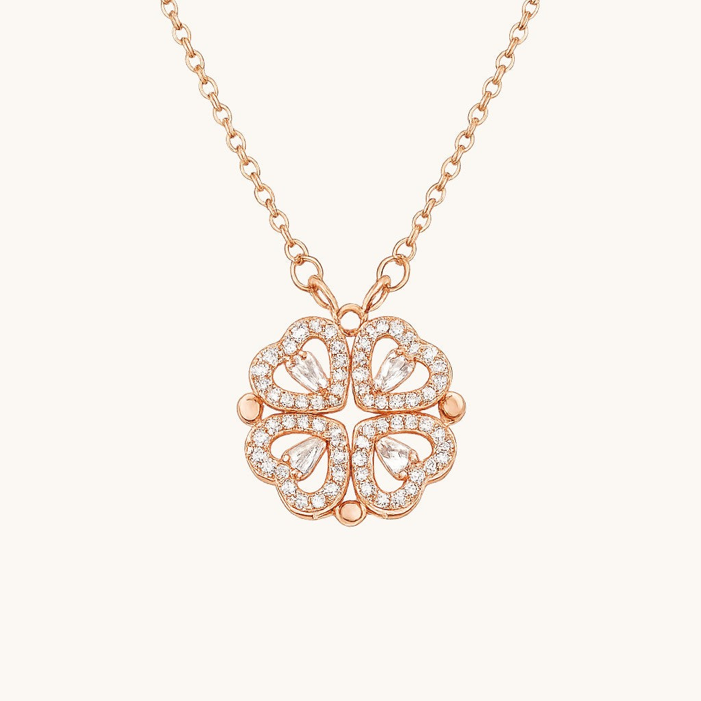 TITLIYA rose gold magnetic four-heart clover pendant necklace with sparkling crystal accents on a delicate chain.