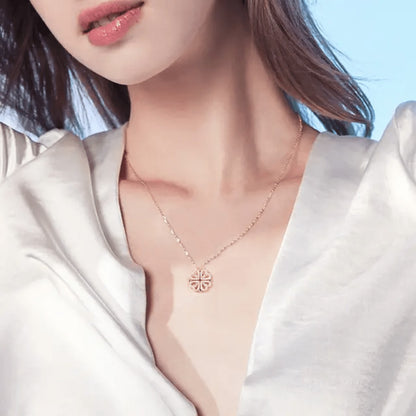 TITLIYA rose gold magnetic four-heart clover pendant necklace worn by a woman in a white satin blouse.