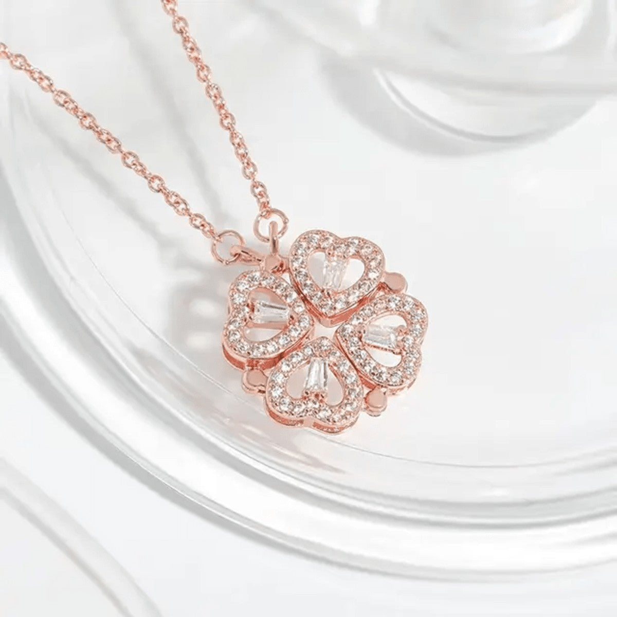 TITLIYA rose gold magnetic four-heart clover pendant necklace with sparkling crystals on a delicate chain.