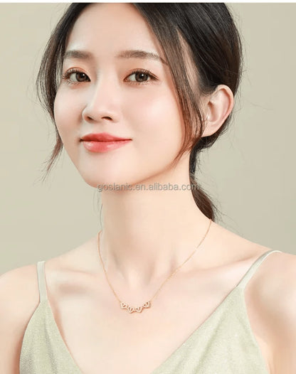 TITLIYA rose gold magnetic four-heart pendant necklace worn by a woman, elegant jewelry for daily wear.