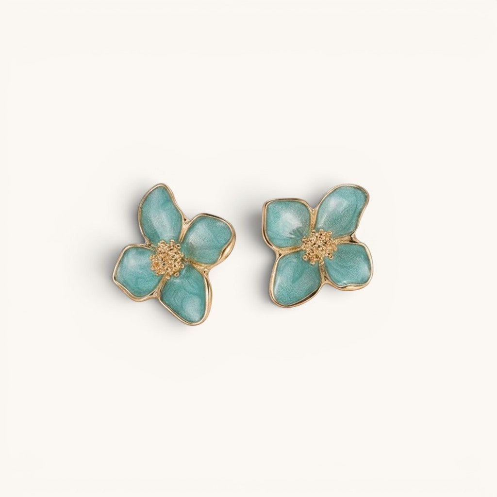 TITLIYA sea green enamel flower stud earrings with textured gold-tone centers in a botanical four-petal design.