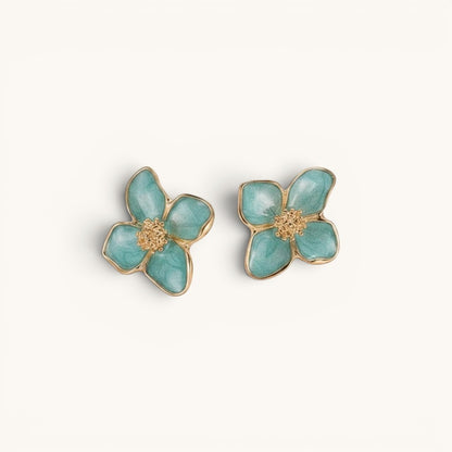 TITLIYA sea green enamel flower stud earrings with textured gold-tone centers in a botanical four-petal design.