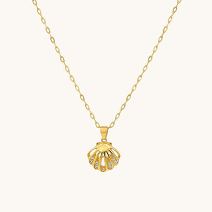 TITLIYA gold-tone shell pendant necklace featuring a central pearl and delicate crystal accents on a link chain.