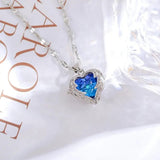 TITLIYA silver plated necklace featuring a blue heart-shaped stone pendant with intricate wing-like detailing.