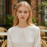 TITLIYA white heart diamond earrings worn by a blonde model in a white top, perfect for elegant daily wear.