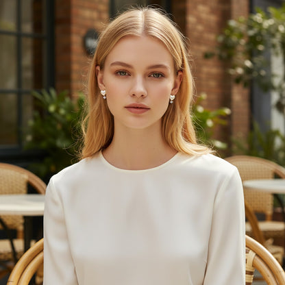 TITLIYA white heart diamond earrings worn by a blonde model in a white top, perfect for elegant daily wear.