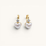 TITLIYA gold-tone hoop earrings featuring a white heart-shaped pearl charm and a sparkling clear diamond accent.