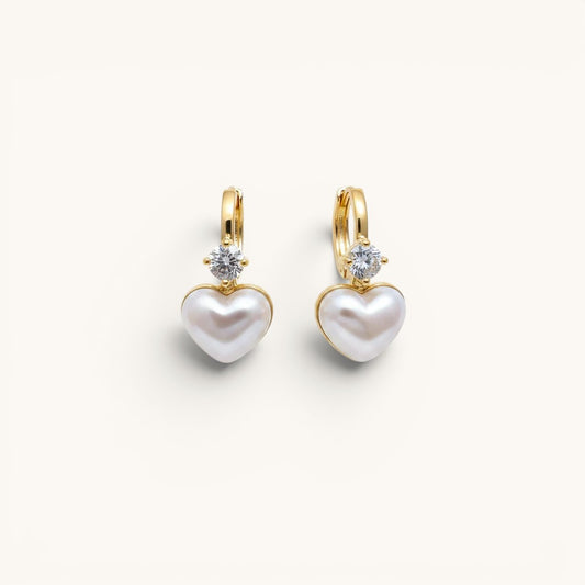 TITLIYA gold-tone hoop earrings featuring a white heart-shaped pearl charm and a sparkling clear diamond accent.
