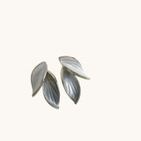 TITLIYA white leaf-shaped Korean stud earrings with elegant metallic detailing for daily wear.